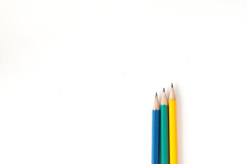 Tree pencils multi-colour on white background for useful like concept business, education and art background