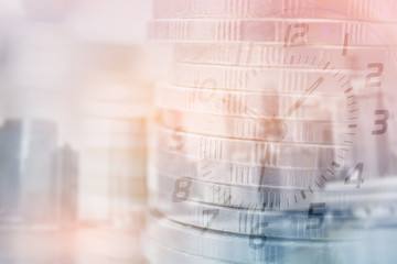 Double exposure of clock and rows of coins with copy space for finance and business concept