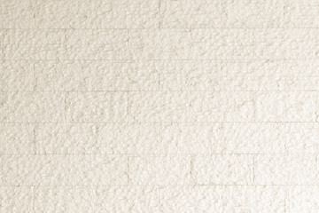 Limestone marble rock tile wall texture pattern background in natural pastel beige color