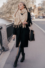 Fototapeta premium Young Woman Outdoors Portrait. Soft Sunny Colors.