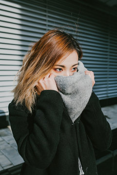 Asian girl appearance closes scarf face