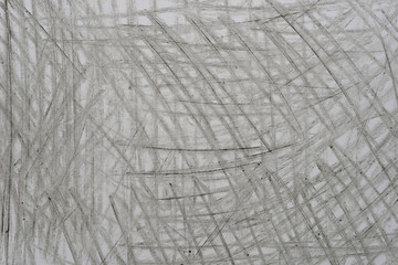 gray crayon doodles on paper background texture