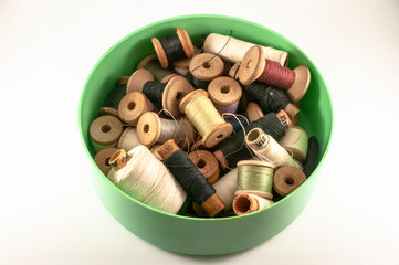 many spools of thread in а plate