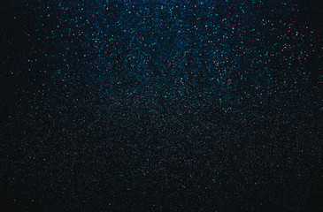 Darkl blue blurred background of glitter, festive, Christmas, New Year. space
