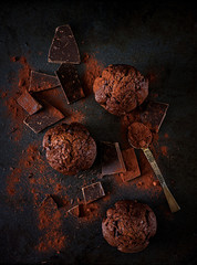 Chocolate muffin on dark background. Top view. Flat lay