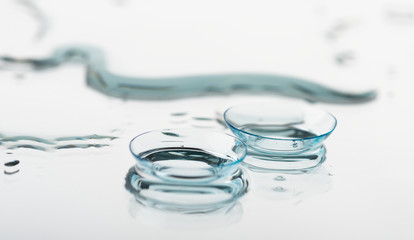 Two contact lenses with reflections