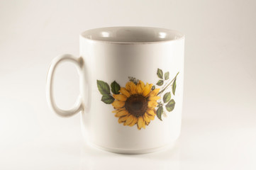 cup of tea with leaves isolated on white background