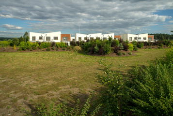 Fototapeta na wymiar Modern settlement of row houses of condominiums.