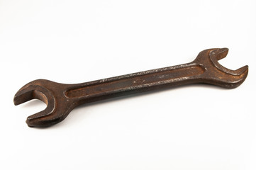 old rusty wrench on white background