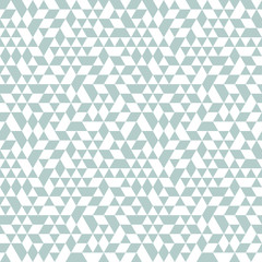 Geometric pattern with light blue and white triangles. Geometric modern ornament. Seamless abstract background