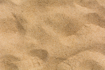 Fototapeta na wymiar The brown sand pattern on the beach