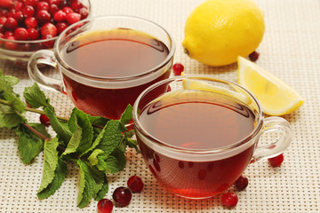 Hot tea with lemons, mint and cranberry