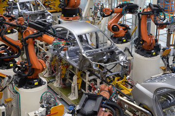 body of car on conveyor top view. Modern Assembly of cars at the plant. The automated build process...