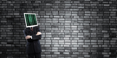 Businessman with monitor instead of head.