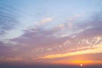 Beautiful orange blue sky with clouds at sunrise
