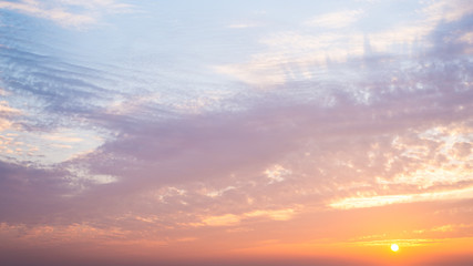 Obraz premium Beautiful orange blue sky with clouds at sunset