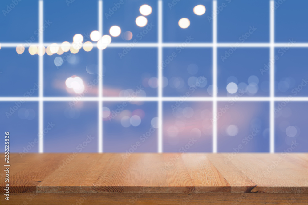Canvas Prints wooden desk with blurred light on road in city with bokeh abstract background