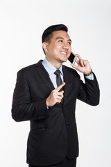 Man in suit talking over the phone