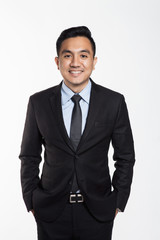 Asian man in office suit posing