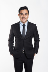 Asian man in office suit posing