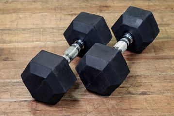 Two black dumbbells