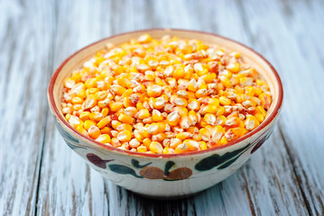 Raw corn grains in a plate