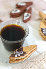 Cup of coffee with cookies. on white wooden board.