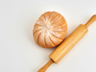 bread on wooden board with wheat
