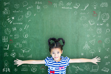 Smart kid educated school student with doodle on chalkboard  for children's education success and scholarship concept
