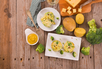 Potato gratins with broccoli florets. 