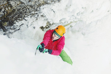 Fototapeta na wymiar Ice climbing on a frozen waterfall.