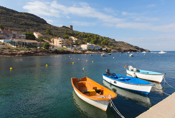 Fototapeta na wymiar La Azohia Murcia Spain with boats moored by the sea, the village located near La Isla Plana and between Puerto de Mazarron and Cartagena