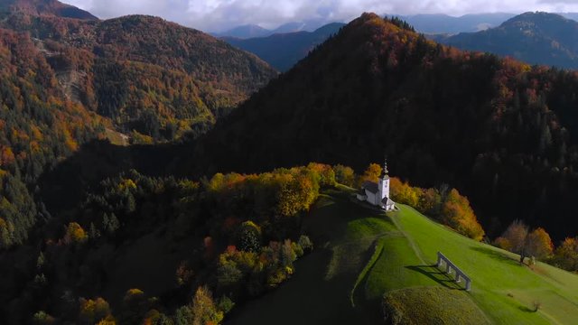 Lonely church on hilltop in picturesque rural Slovenia, 4K aerial drone footage.