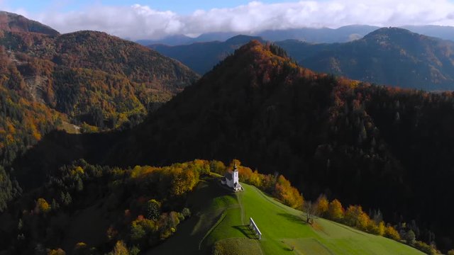 Lonely church on hilltop in picturesque rural Slovenia, 4K aerial drone footage.