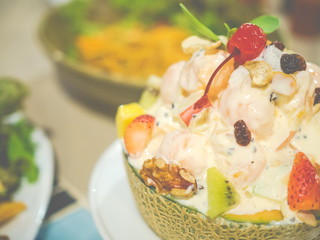 Close up bowl of fruit salad, Healthy fresh fruit salad served in bowls with fresh cantaloupe
