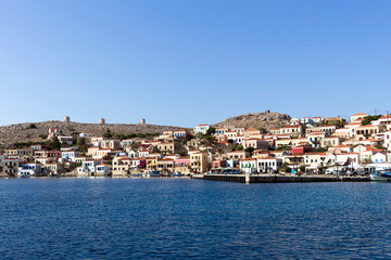 Fototapeta na wymiar The seafront of Emporio, Chalki, Halki island. Aegean sea, Dodecanese Islands, Greece 