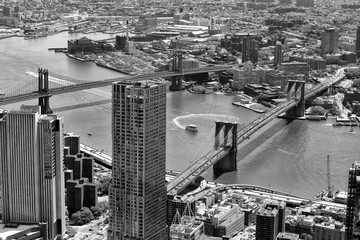 New York cityscape. Top view on Brooklyn Bridge, USA. BW