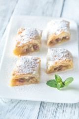 Slices of apple strudel on the white plate