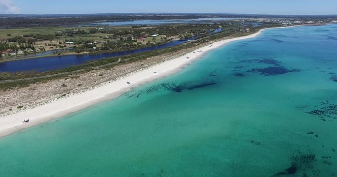 Vertical upwards dolley from drone of prisitne beach and hinterland at Busselton Video 3