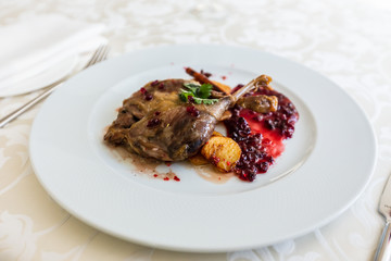 Duck leg confit with mountain cranberries sauce and pear chutney