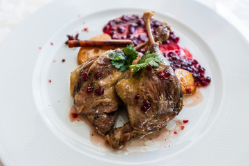 Duck leg confit with mountain cranberries sauce and pear chutney