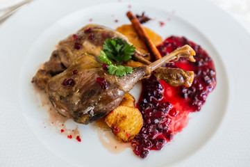 Duck leg confit with mountain cranberries sauce and pear chutney