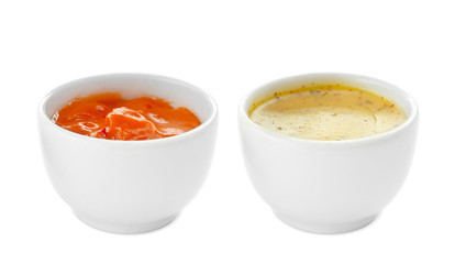 Tasty sauces in bowls on white background