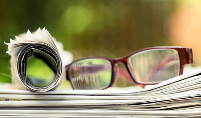 Daily news, reading concept, newspaper with with eyeglasses