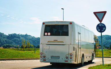 White Tourist bus on road in Poland