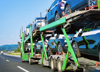 Cars carrier truck at asphalt highway road Poland