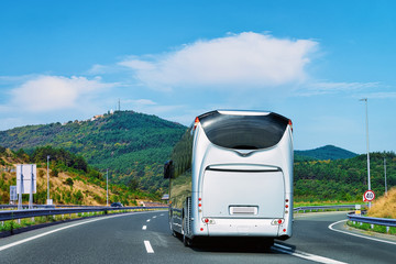 White Tourist bus at road in Poland