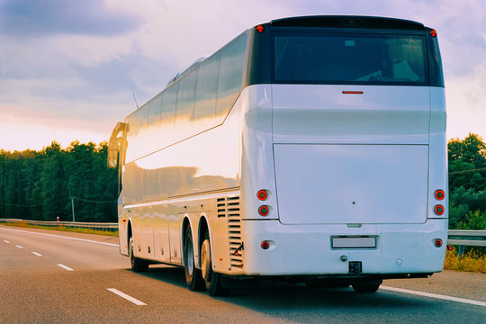 White Tourist bus in highway road in Poland