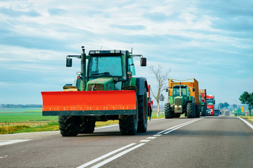 Agricultural tractor in highway road Poland