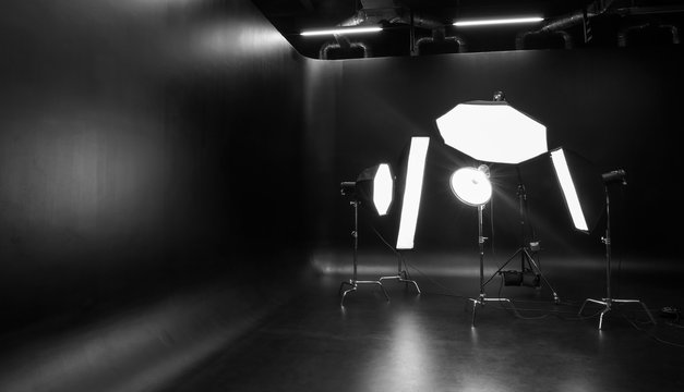 Interior of modern photo studio with professional lighting equipment